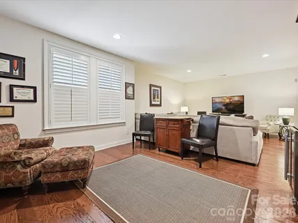 a bedroom with furniture and a window