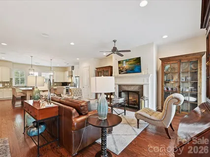 a living room with fireplace furniture and a fireplace