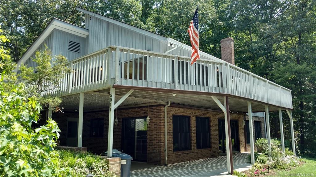5011 Addison Road Waxhaw, NC 28173 - Photo 1 of 23 a view of a house with wooden deck and a garden