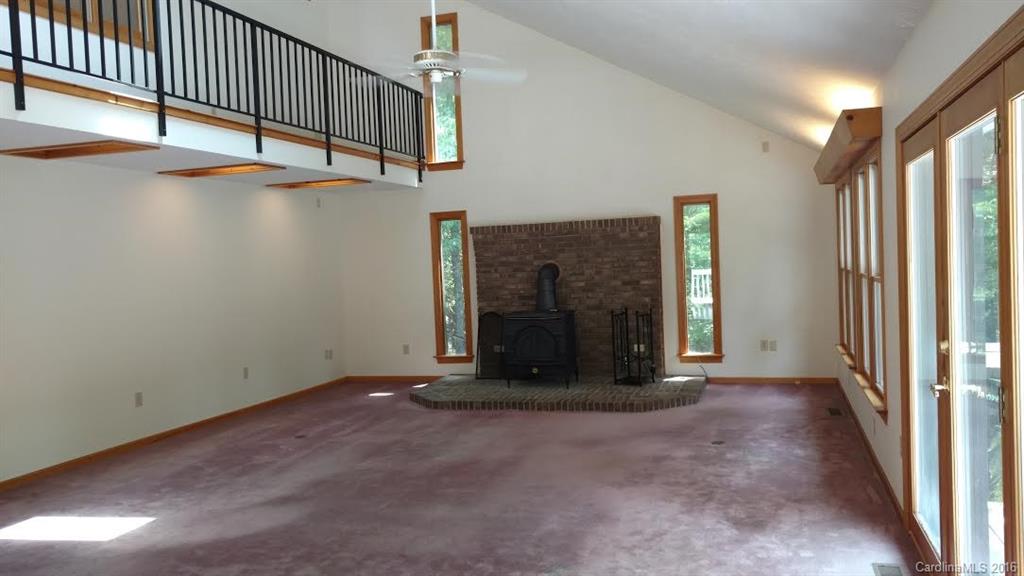 5011 Addison Road Waxhaw, NC 28173 - Photo 2 of 23 a view of an empty room with wooden floor and a window