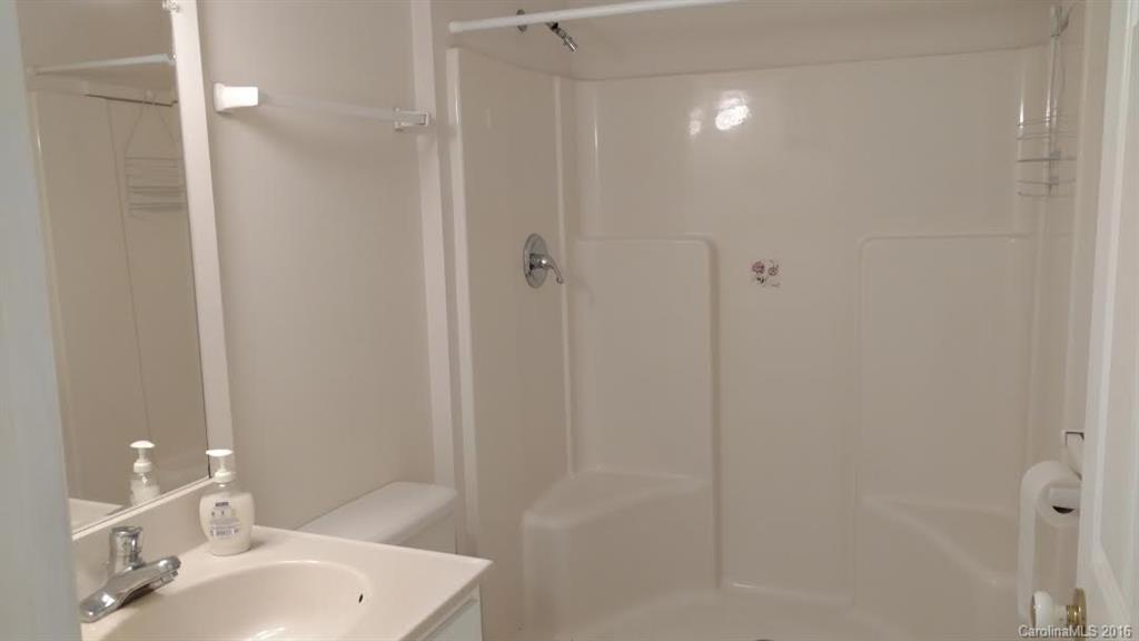 5011 Addison Road Waxhaw, NC 28173 - Photo 15 of 23 a bathroom with a sink and shower