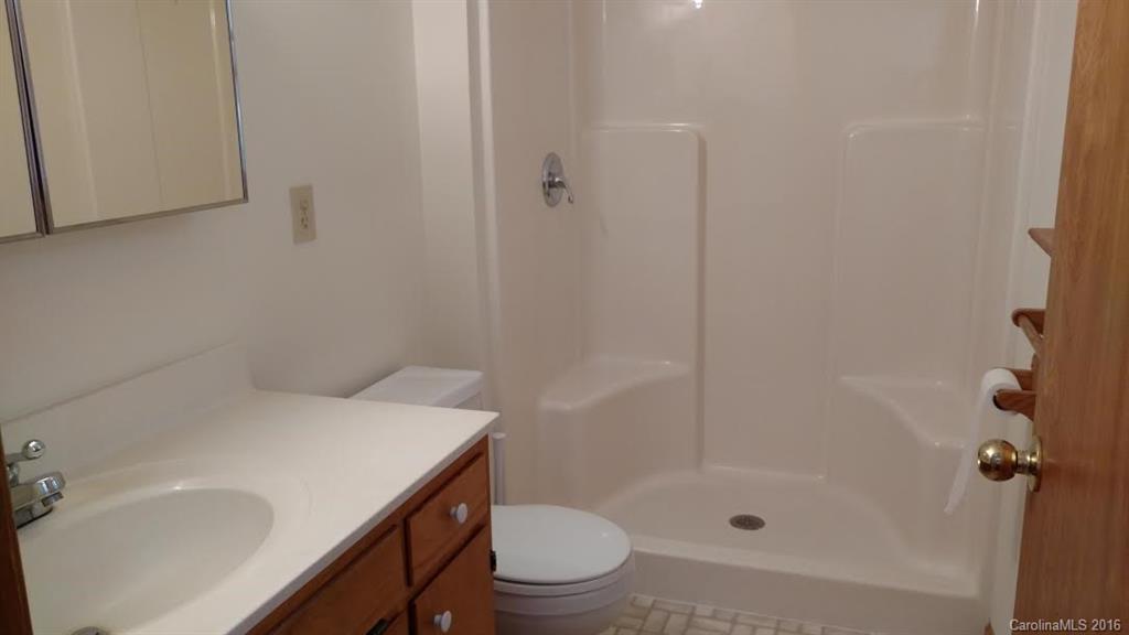 5011 Addison Road Waxhaw, NC 28173 - Photo 18 of 23 a bathroom with a sink a toilet and shower