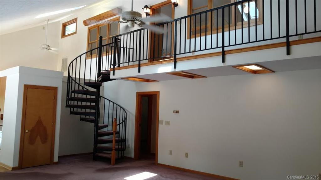 5011 Addison Road Waxhaw, NC 28173 - Photo 3 of 23 a view of staircase with railing and white walls