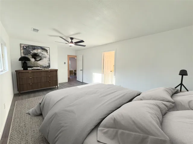 a bedroom with a bed and window