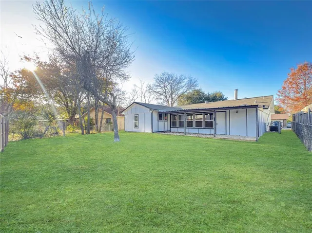 a view of a house with a big yard