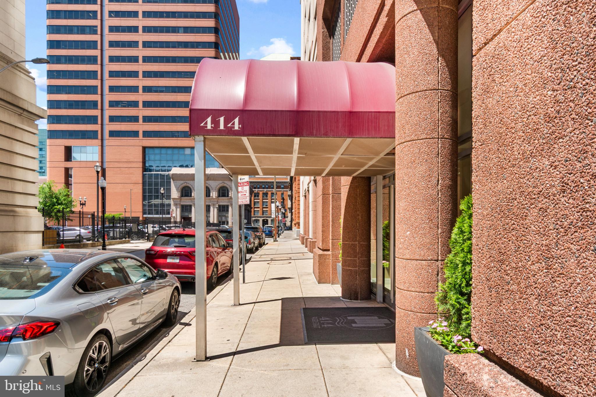 414 Water Street, Unit 1315 Baltimore, MD 21202 - Photo 3 of 30 a view of a patio with table and chairs under an umbrella