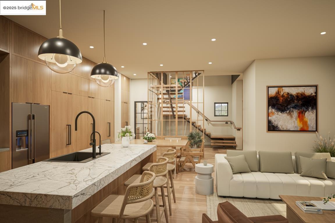 0 Girvin Drive Oakland, CA 94611 - Photo 20 of 30 a living room with furniture kitchen view and a chandelier