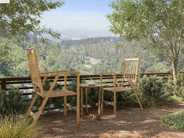 a backyard of a house with table and chairs