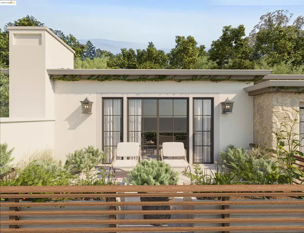 front view of a house with a fountain and a bench