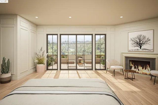 a spacious bedroom with a large bed and a fireplace