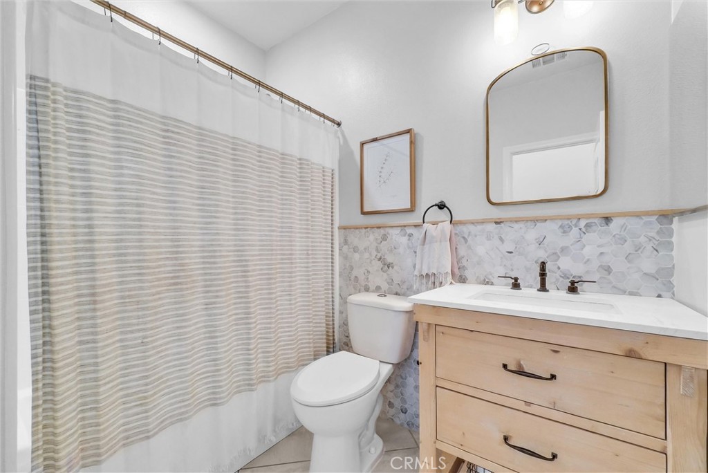 37656 Needlegrass Road Murrieta, CA 92563 - Photo 13 of 29 One full bathroom downstairs means one lucky person won't use the stairs.
