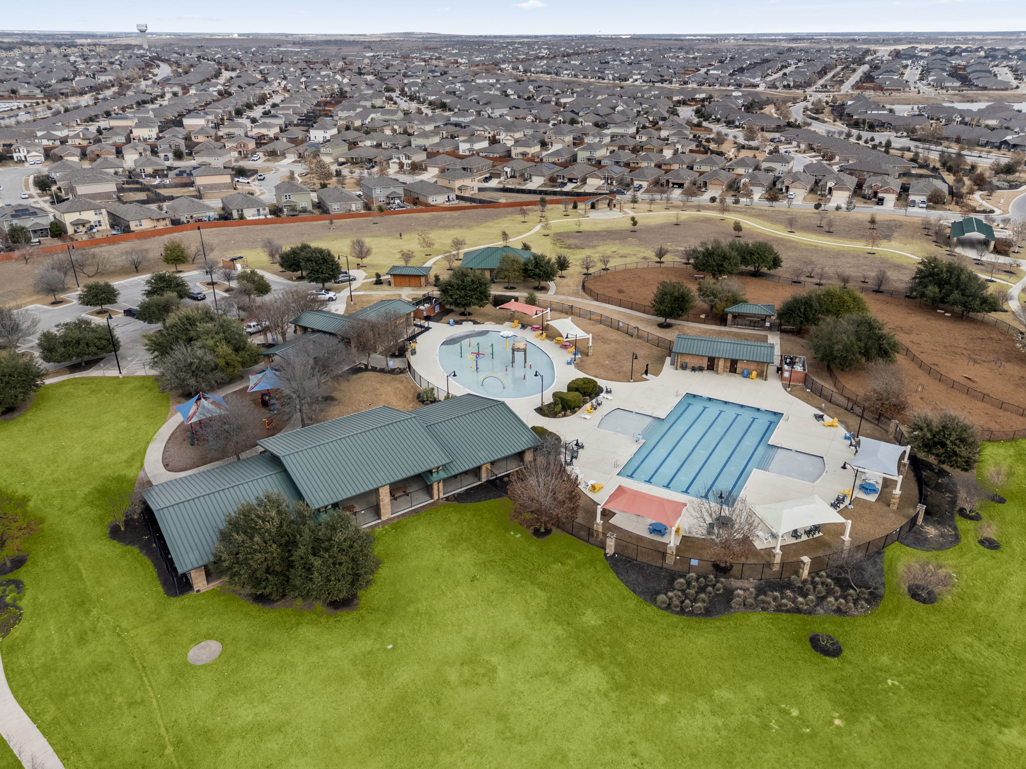 1098 Cherrystone Loop Buda, TX 78610 - Photo 35 of 37 an aerial view of a house with garden space and parking