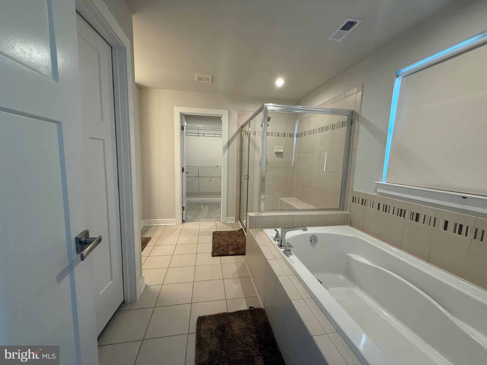 440 Tree Of Heaven Way Newark, DE 19713 - Photo 13 of 27 a bathroom with a bathtub and a shower