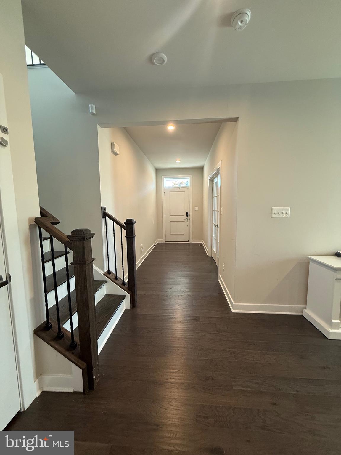 440 Tree Of Heaven Way Newark, DE 19713 - Photo 22 of 27 a view of a hallway with wooden floor