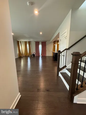 a view of lobby with stairs and wooden floor