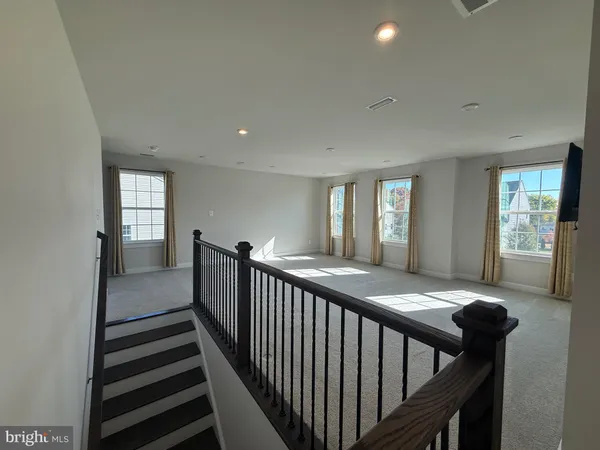 a view of a hallway with windows
