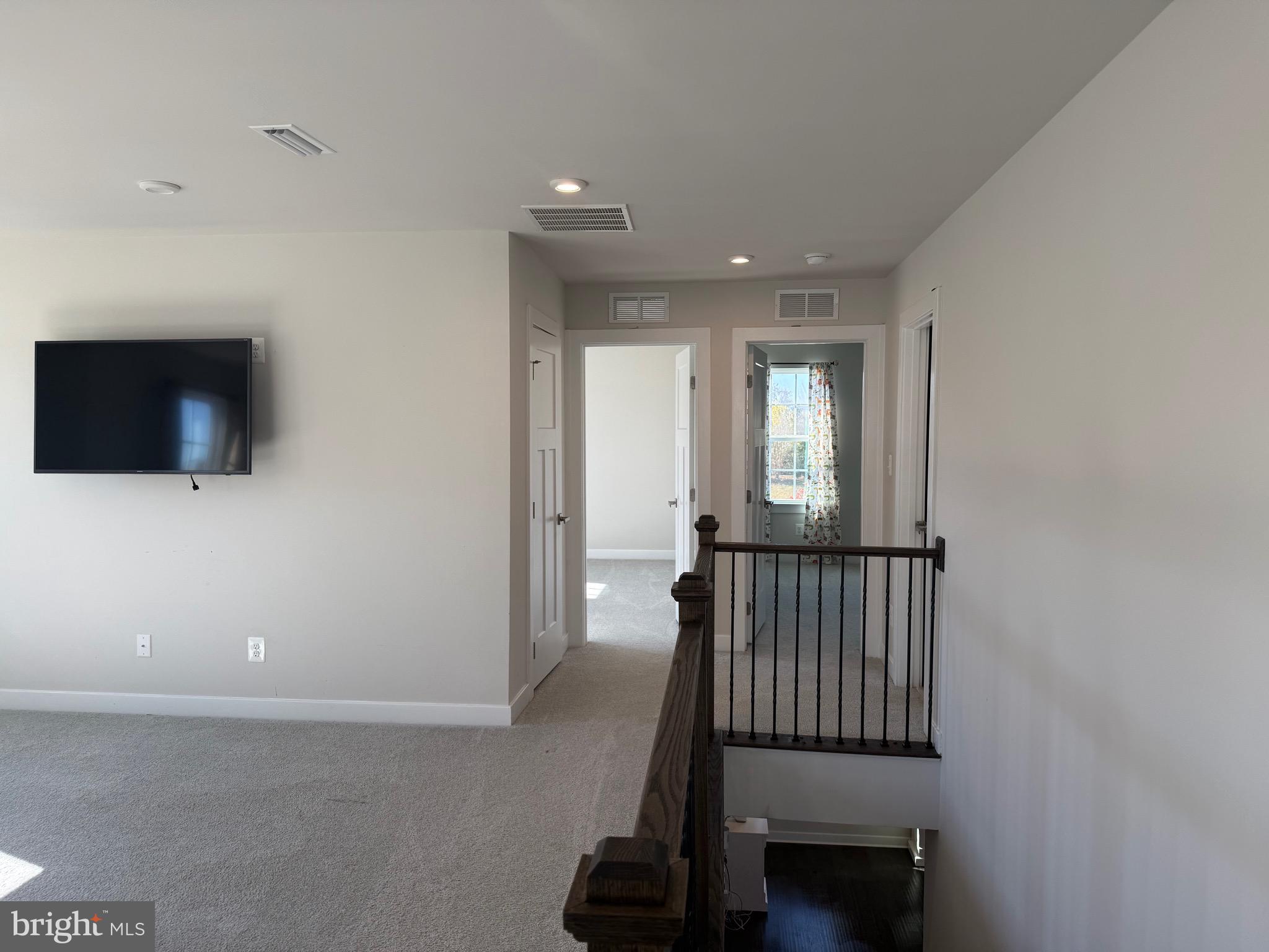 440 Tree Of Heaven Way Newark, DE 19713 - Photo 10 of 27 a view of a hallway with workspace and livingroom with furniture