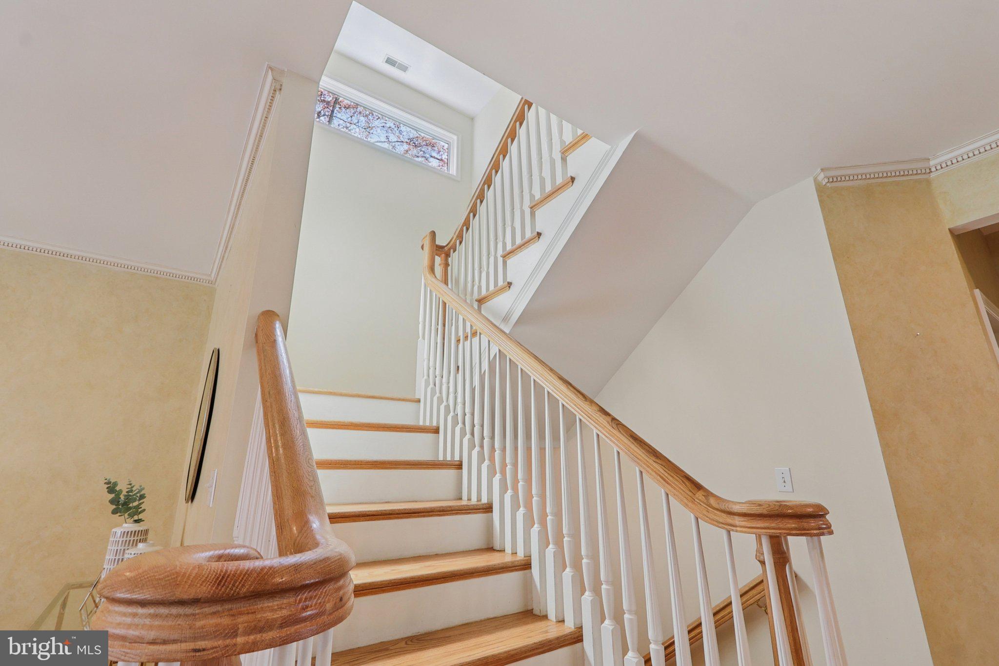 5602 Ogden Road Bethesda, MD 20816 - Photo 40 of 87 Staircase w transom window. Leads to 2nd floor.