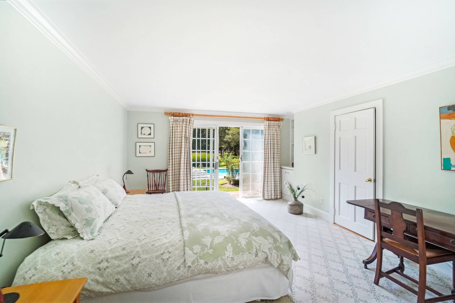 25 Club Lane Remsenburg, NY 11960 - Photo 9 of 18 a bedroom with a bed and a window