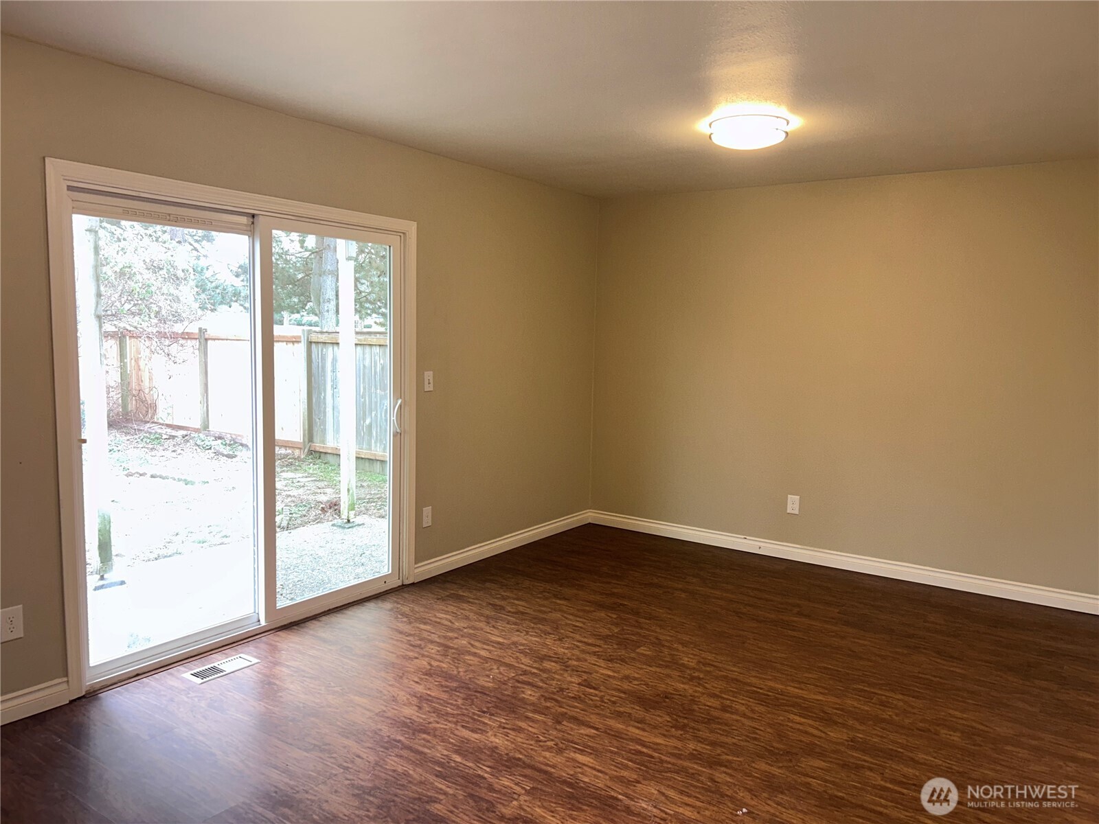 17254 153rd Street Southeast Monroe, WA 98272 - Photo 7 of 17 a view of an empty room with wooden floor and a window