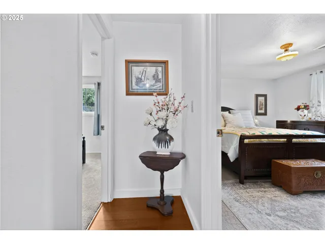 a living room with stainless steel appliances kitchen island granite countertop furniture and a potted plant
