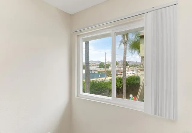 a view of a glass door and a window