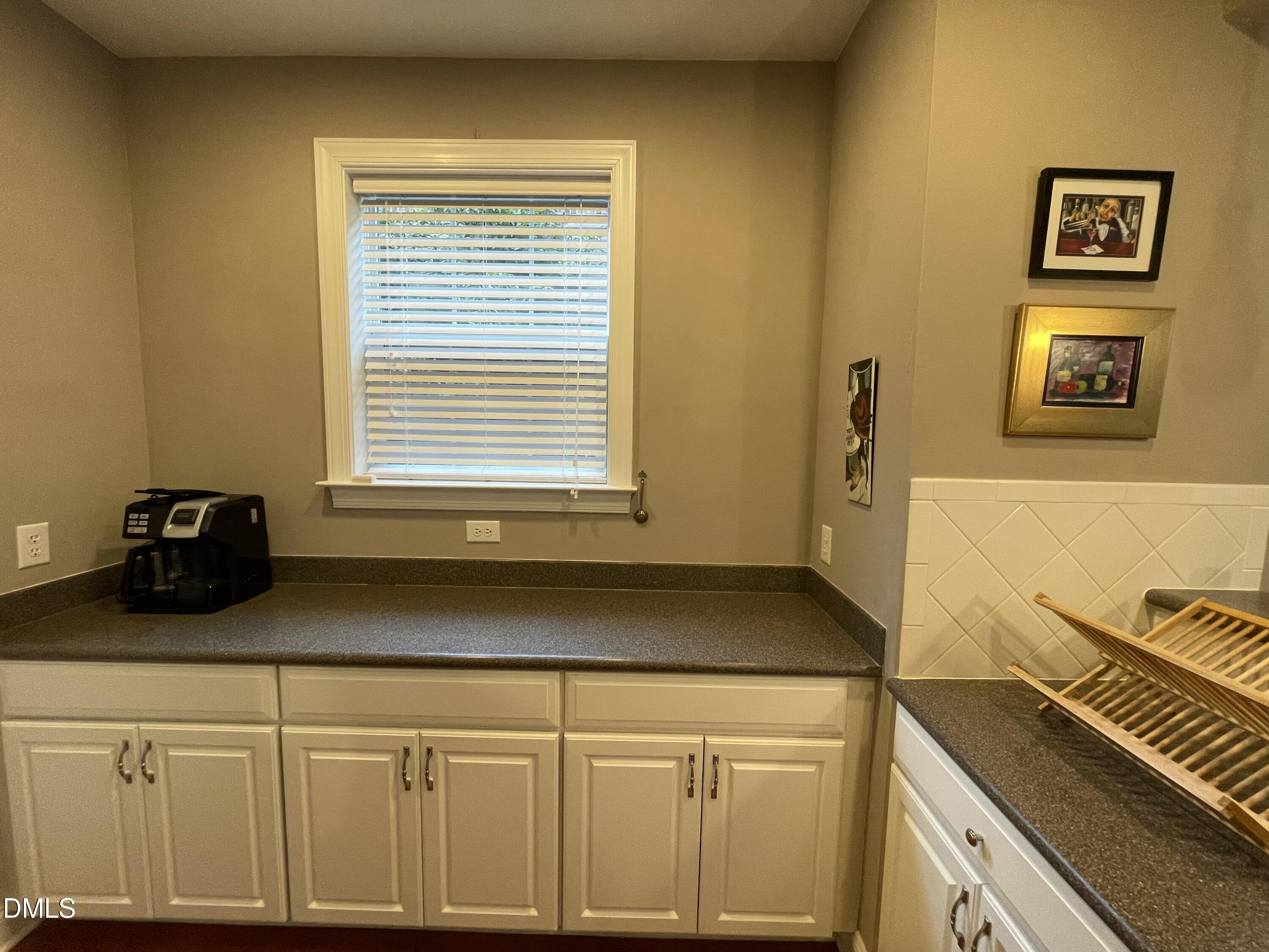 10411 Rosegate Court, Unit 3 Raleigh, NC 27617 - Photo 15 of 62 a kitchen with a sink and a stove top oven