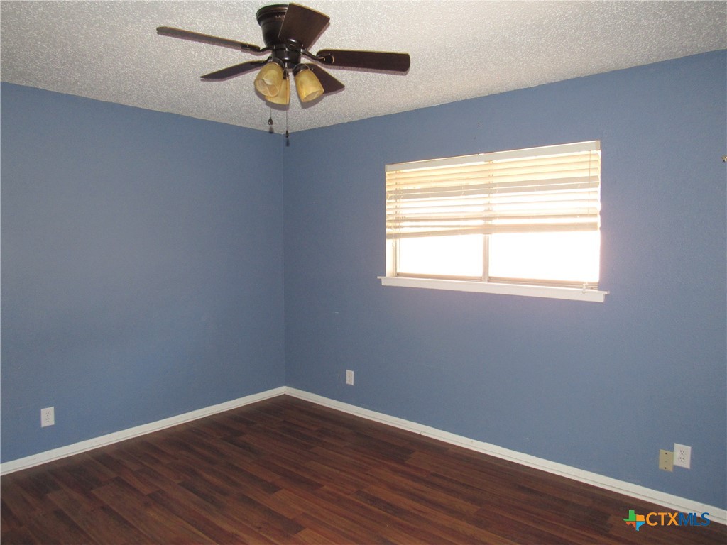 1325 Paseo Del Cobre Temple, TX 76502 - Photo 9 of 15 a view of an empty room with window and wooden floor