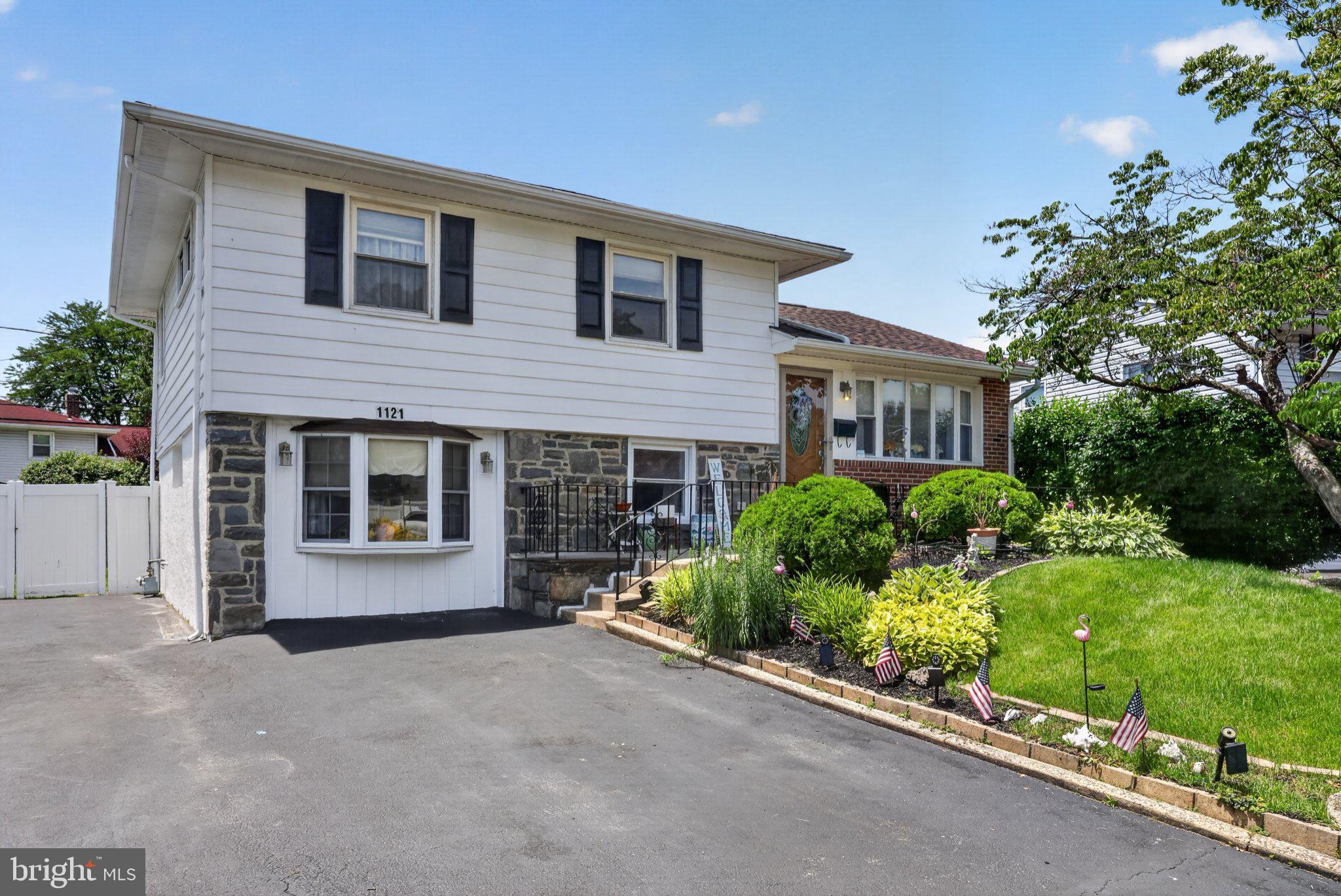 1121 Wynnbrook Road Secane, PA 19018 - Photo 3 of 36 Charming split-level home with lush greenery.