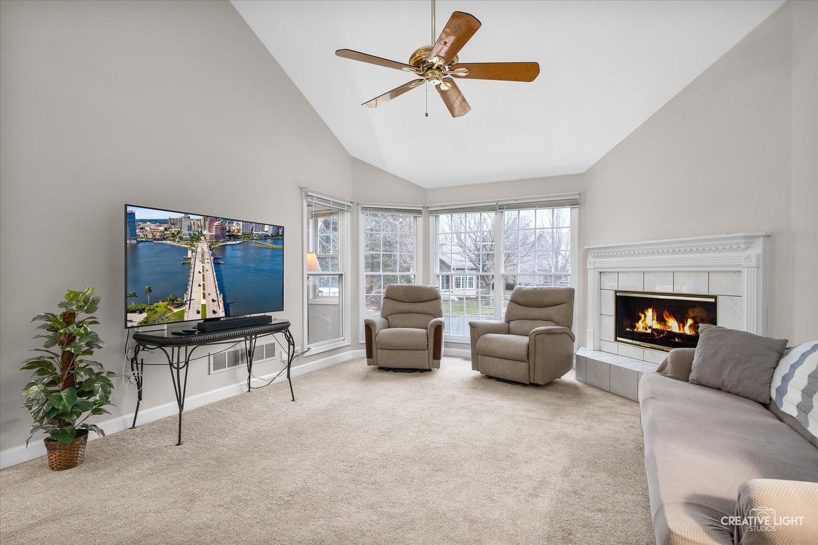 2262 Brookside Lane Aurora, IL 60502 - Photo 11 of 37 a living room with furniture and a flat screen tv
