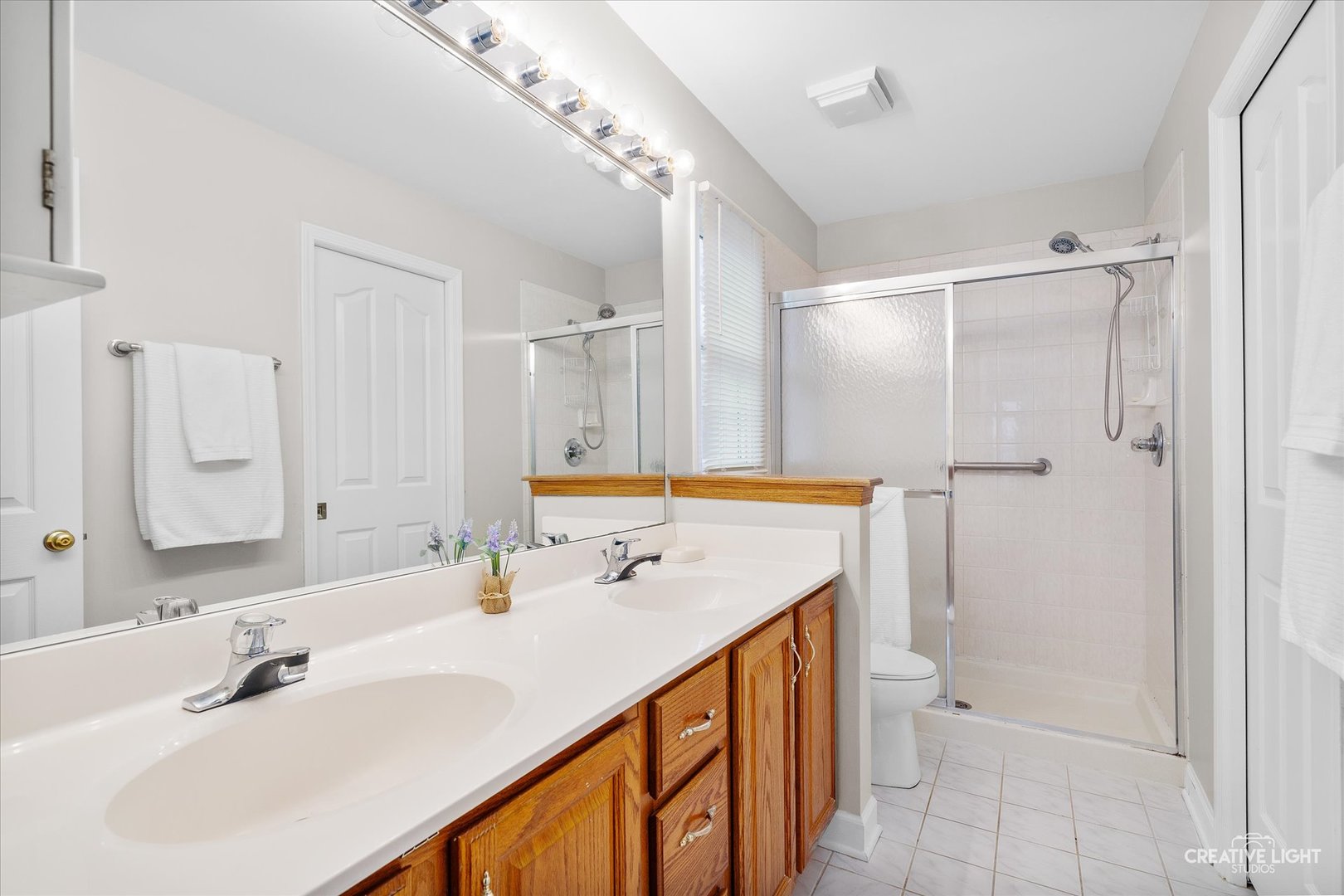 2262 Brookside Lane Aurora, IL 60502 - Photo 15 of 37 a bathroom with a sink double vanity and a mirror