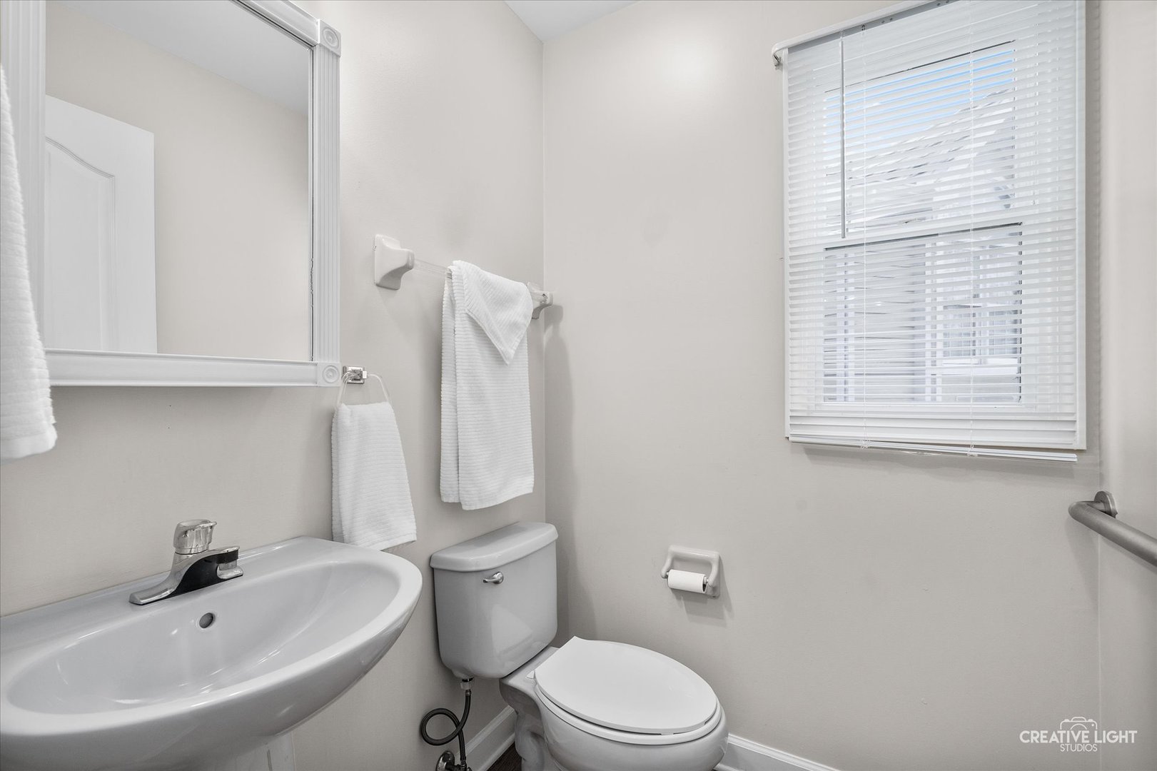 2262 Brookside Lane Aurora, IL 60502 - Photo 21 of 37 a white toilet sitting next to a bathroom sink
