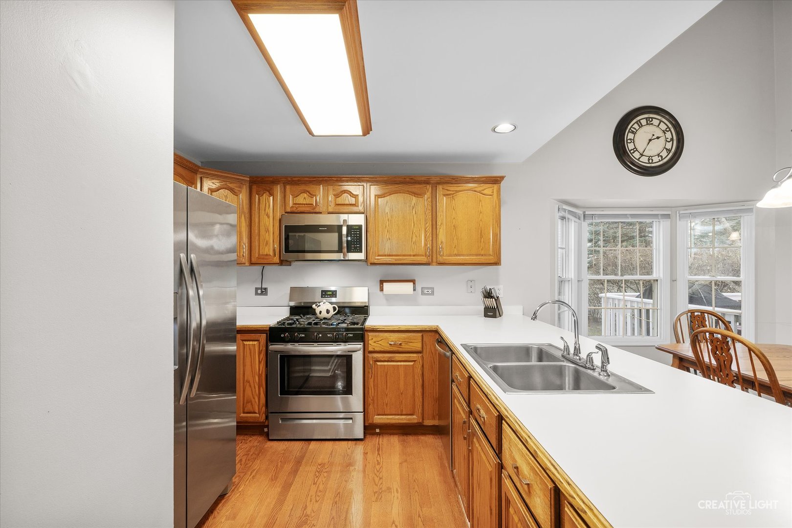 2262 Brookside Lane Aurora, IL 60502 - Photo 7 of 37 a kitchen with a sink a stove and cabinets