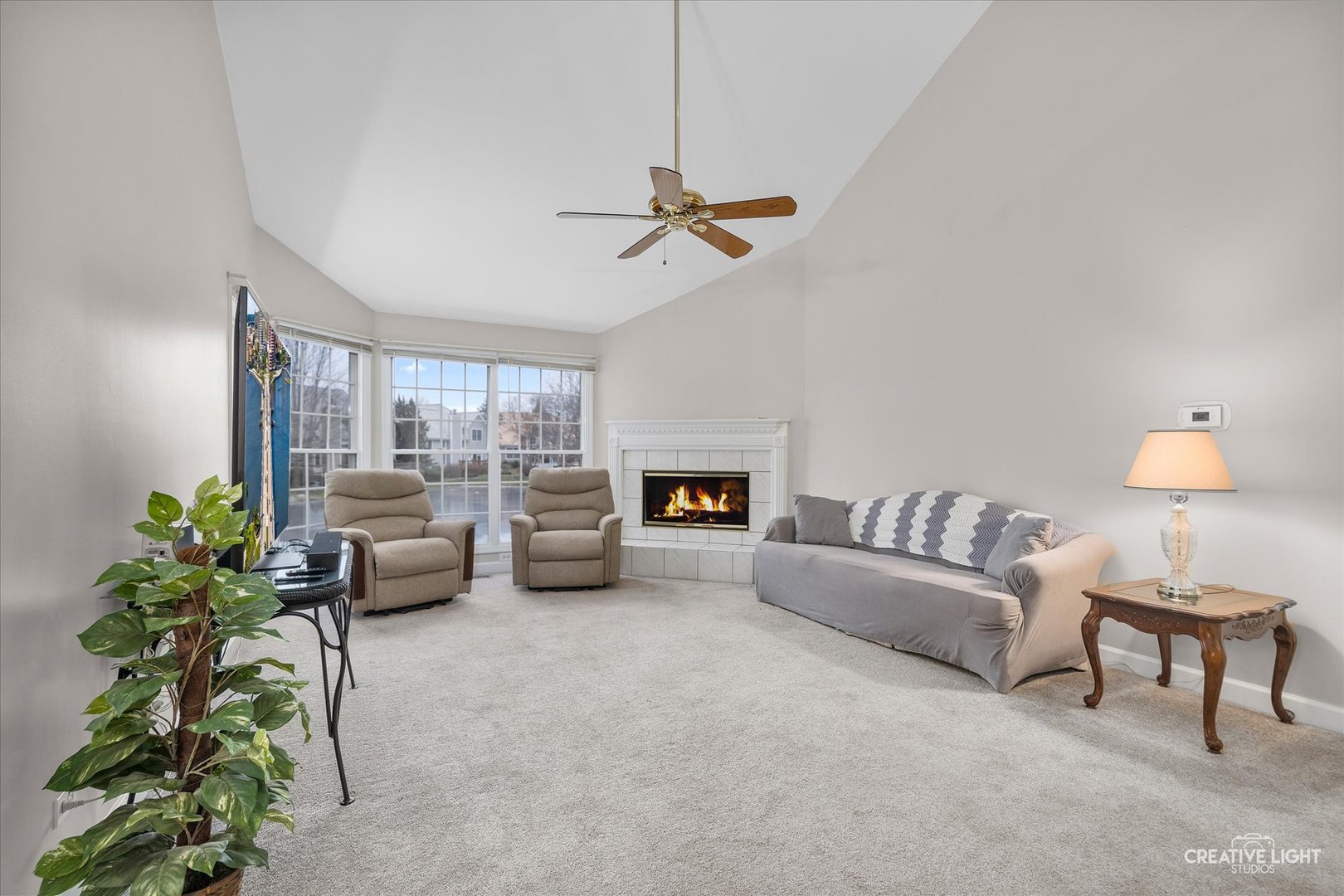 2262 Brookside Lane Aurora, IL 60502 - Photo 10 of 37 a living room with furniture and a chandelier