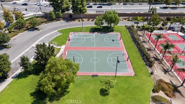 an aerial view of a house with a garden and lake view