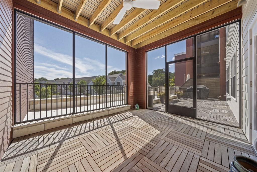15 Revolution Way, Unit 2107 Canton, MA 02021 - Photo 27 of 40 a view of a balcony with wooden floor