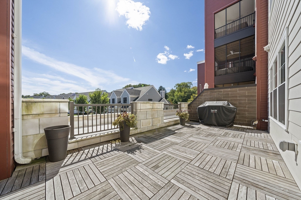 15 Revolution Way, Unit 2107 Canton, MA 02021 - Photo 29 of 40 a view of a balcony with furniture