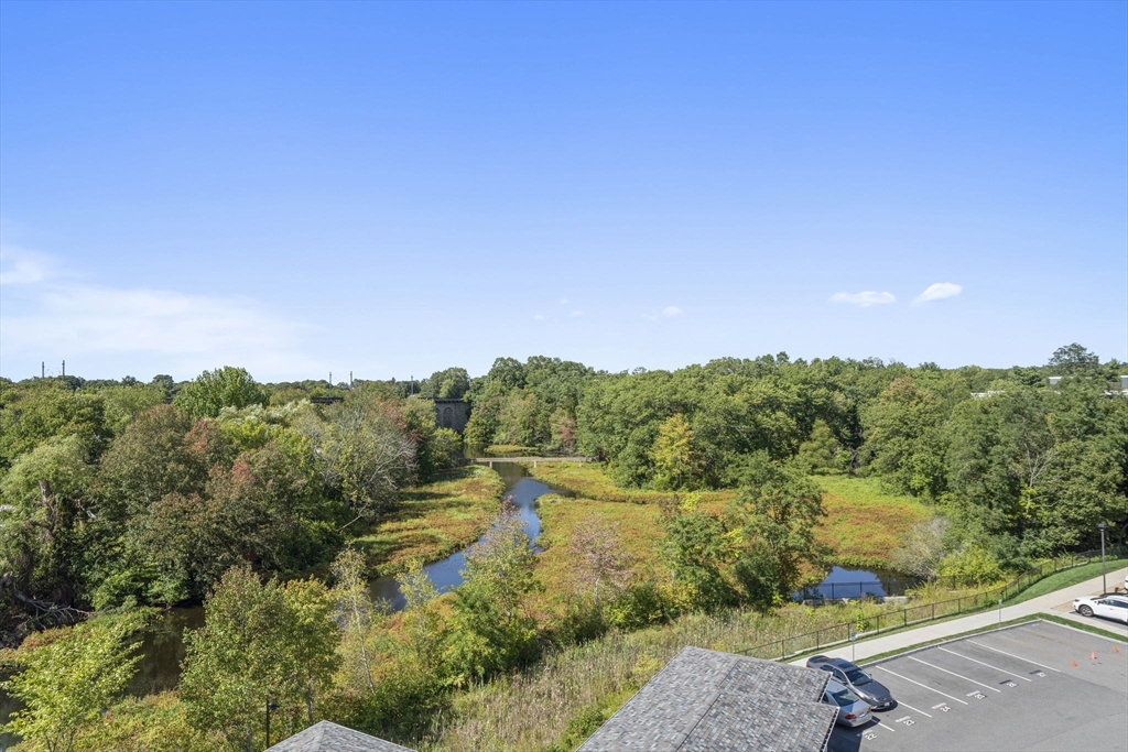15 Revolution Way, Unit 2107 Canton, MA 02021 - Photo 32 of 40 a view of a lake with a mountain in the background