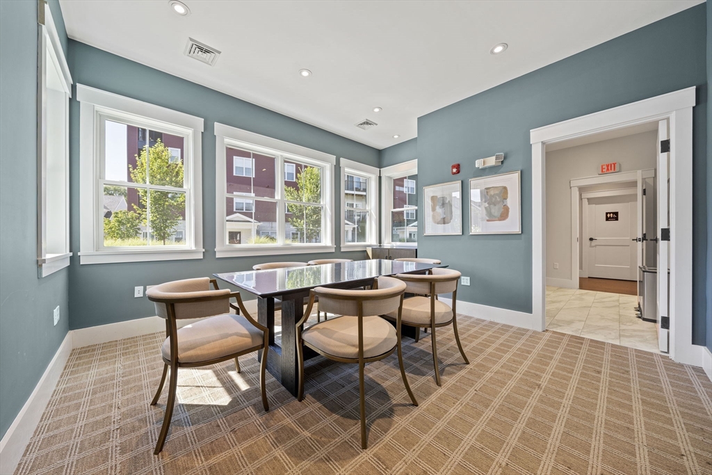 15 Revolution Way, Unit 2107 Canton, MA 02021 - Photo 38 of 40 a dining room with furniture and window