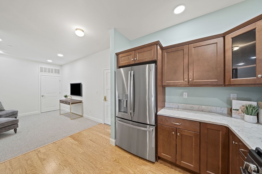 15 Revolution Way, Unit 2107 Canton, MA 02021 - Photo 9 of 40 a kitchen with stainless steel appliances a refrigerator and cabinets