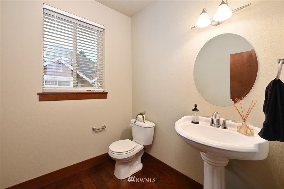 3805 Northeast 3rd Place Renton, WA 98056 - Photo 14 of 30 a bathroom with a toilet a sink and mirror