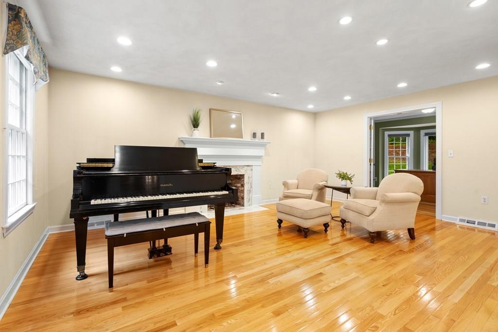 35 Hawes Road Sudbury, MA 01776 - Photo 6 of 41 a living room with furniture a piano and a flat screen tv