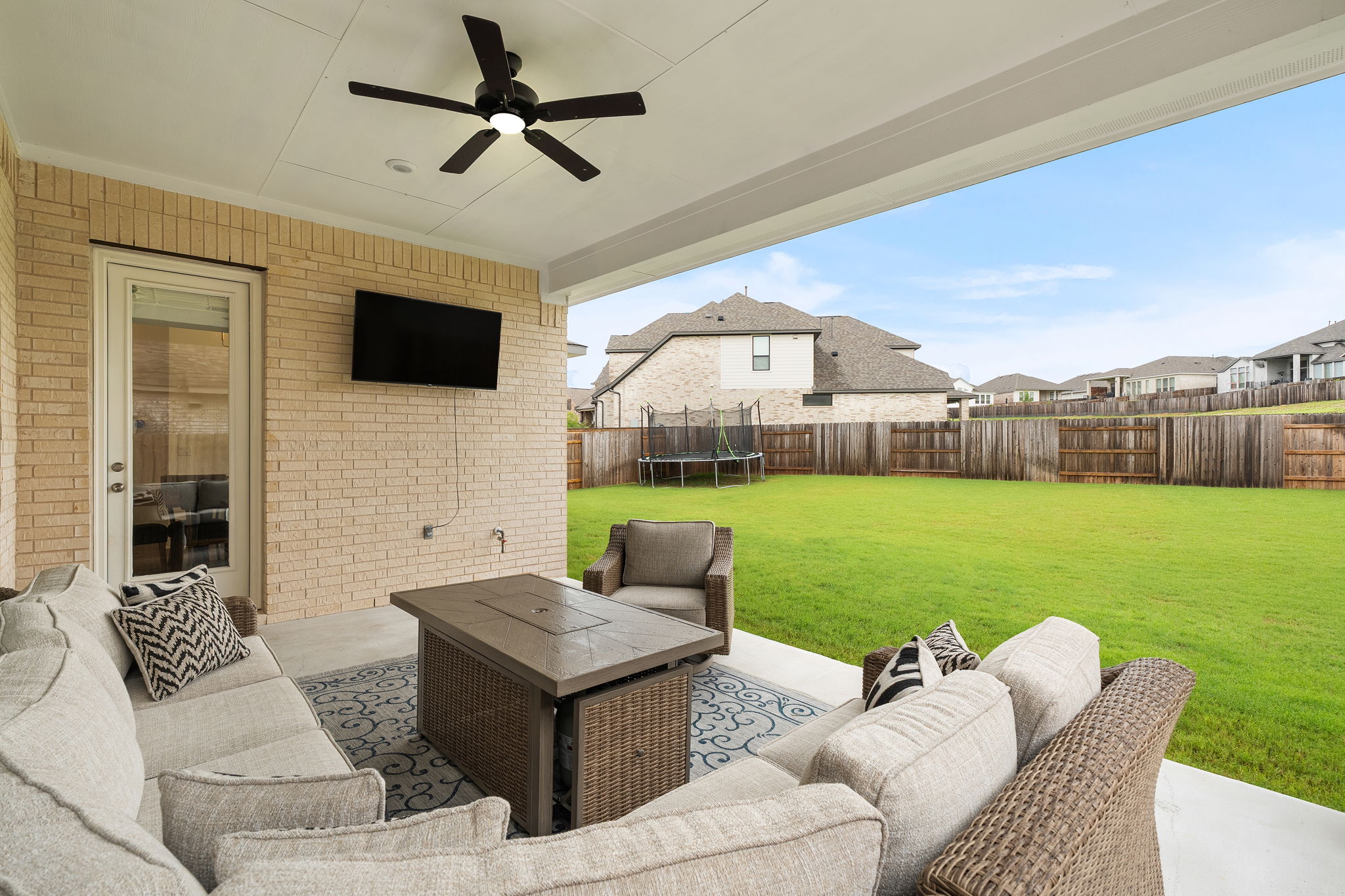 515 Watershield Cove Georgetown, TX 78633 - Photo 34 of 40 An inviting covered patio with ceiling fan extends living space outdoors.