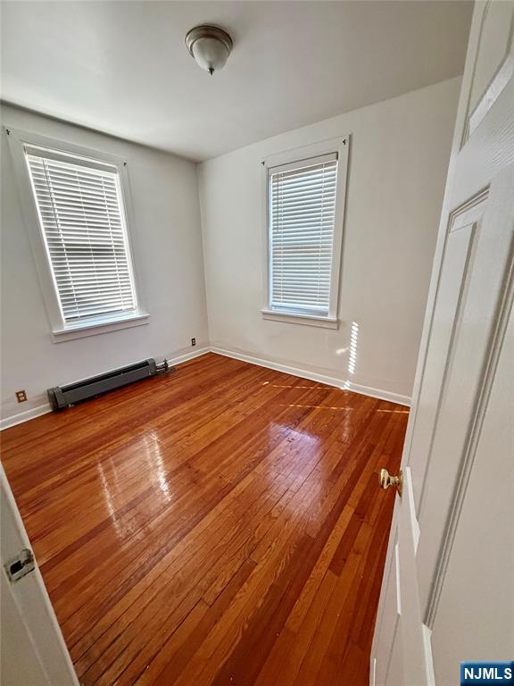 823 Glen Road, Unit 2S Fort Lee, NJ 07024 - Photo 3 of 4 a view of an empty room with windows