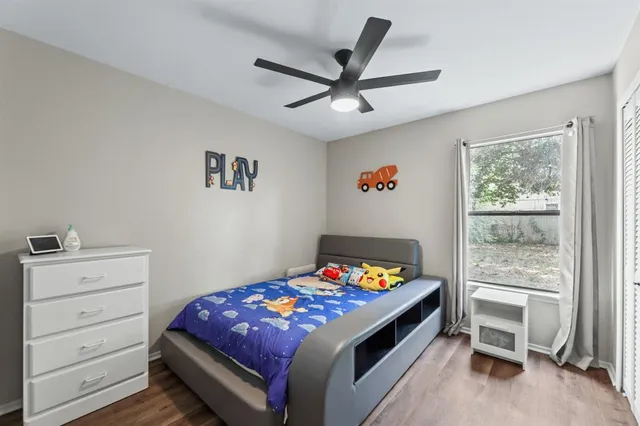 a bed room with a bed and a window