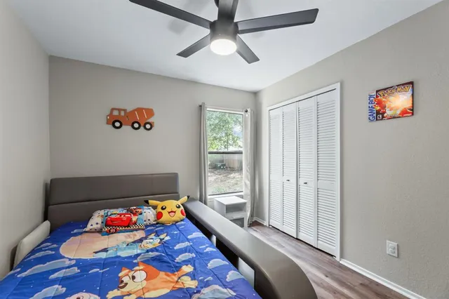 a bedroom with furniture and a rug