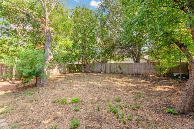 a backyard of a house with lots of green space