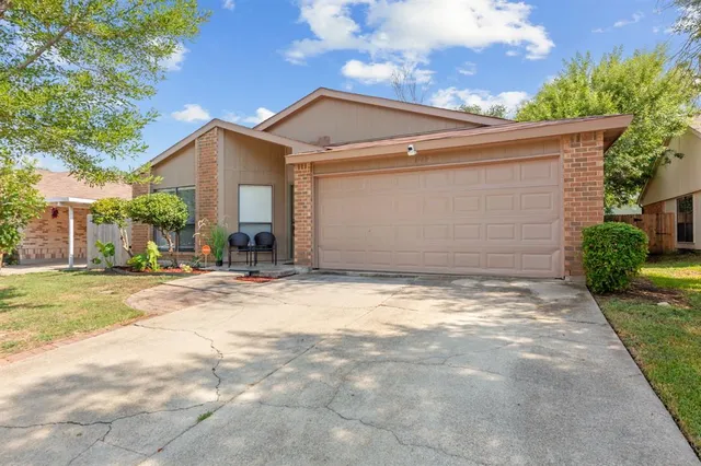 a backyard of a house with yard and garage