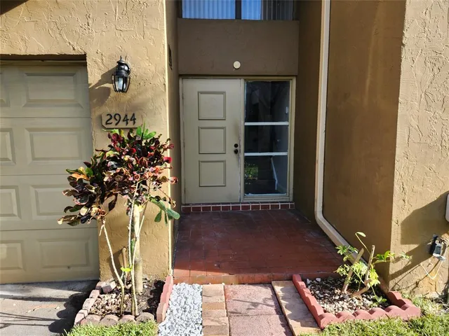 a vase of flowers sitting on a floor
