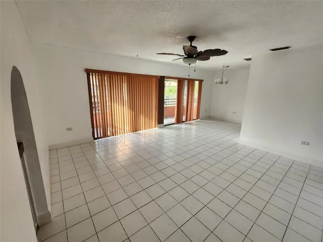 a kitchen with stainless steel appliances granite countertop a stove a refrigerator and a sink